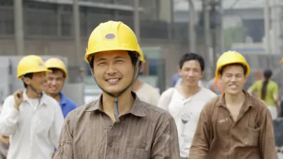 Migrant workers smiling