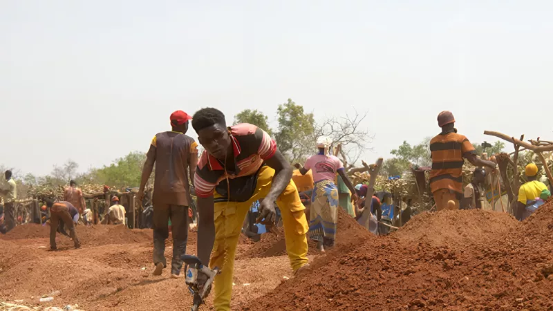 People working in a quarry under the sun