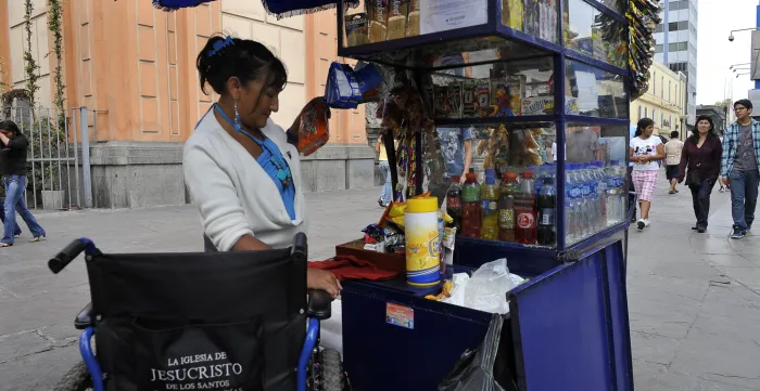 Handicapped woman, selling in the streets of Lima, Peru.