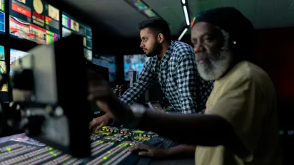 2 men working with engineer tablets and screens